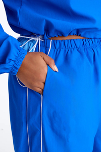 Ensemble de survêtements de sport OEM de haute qualité pour femmes, coupe-vent, léger, en nylon imprimé, couleur unie - Product Image 6