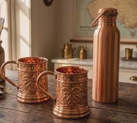 Mugs en cuivre de qualité export avec feuilles gravées et ensemble de bouteilles d'eau en cuivre pour boissons, style vintage, design métallique durable