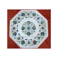 Table basse octogonale en marbre blanc attrayant avec une finition de qualité et un design unique avec incrustations florales pour la maison et l'hôtel
