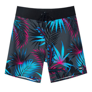 Shorts de bain décontractés pour hommes à imprimé floral tropical en toile, séchage rapide, taille élastique avec cordon de serrage, taille mi-haute, avec poches et logo frontal - Product Image 1