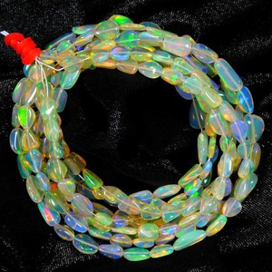 Perlas de ópalo de fuego etíope natural de 4x6mm y 7x9mm, perlas lisas de ópalo de fuego Welo para la fabricación de joyas a precio de mayorista. - Product Image 1