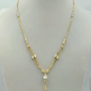 Exquisito brazalete Dokiyu chapado en oro de 22 quilates para mujer con un elegante diseño en Y de múltiples hilos y cuentas texturizadas de dos tonos. - Product Image 2