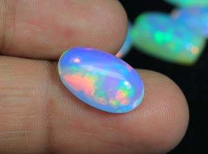 Hermoso ópalo etíope cabujón, tono azul, destellos arcoíris, forma ovalada, piedra preciosa de ópalo a precio de mayorista. - Product Image 6