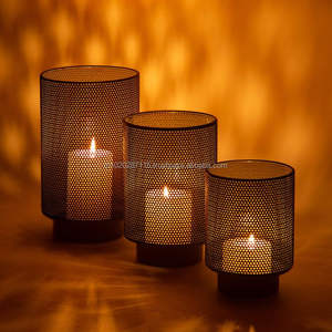 Laser cut design iron votive candle holder that enhances living room <b>aesthetics</b> with its soft glowing ambient candlelight - Product Image 1
