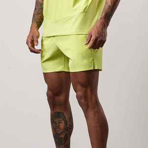 Shorts de sport pour homme en polyester tissé, vert lime uni, séchage rapide, avec poches, taille élastique, longueur mi-cuisse - Product Image 4