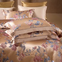 Parure de lit de luxe en soie de mûrier or rose, quatre pièces, avec housse de couette imprimée, drap et taies d'oreiller en fil teint naturel