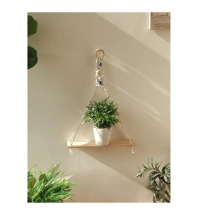 Evil Eye Design Macrame Wall Hanging Shelf With Wooden Base Perfect For Garden Decor Plants Storage And Outdoor Display - Product Image 1