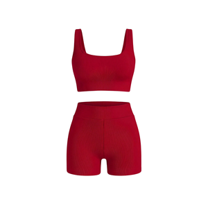 Conjunto de Yoga OEM de Nylon y Spandex de Alta Elasticidad para Ropa Deportiva Transpirable con Sensación de Segunda Piel, 4 Piezas, Sujetador Deportivo Sólido con Diseño Trenzado - Product Image 1