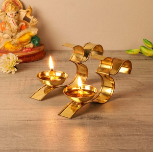 Brass Om Shape Decorative Oil Lamp Diya <b>Stand</b> Holder Pair for Home Temple Puja, available at wholesale prices. - Product Image 1
