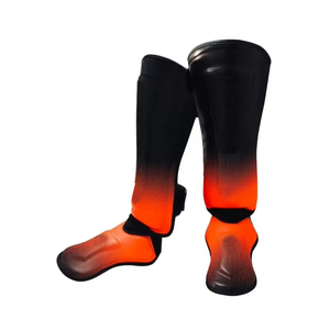 Protège-tibias réglables en cuir noir et orange avec fermeture auto-agrippante pour la boxe, le MMA et le Muay Thai – Équipement de protection unisexe léger - Product Image 4