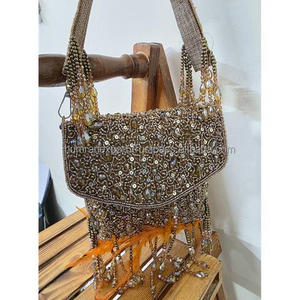 Elegant beaded Trendy Tassel Embroidered <b>Clutch</b> for Women Elegant Pearl Work Embroidered Bridal <b>Clutch</b> from INDIA - Product Image 1