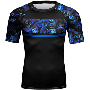 Men's <b>Black</b> Short Sleeve Rash Guard With Blue Tropical Print Quick Dry <b>Compression</b> <b>Shirt</b> For MMA Training - Product Image 1