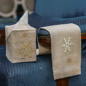 Gold snowflake embroidery brings warm holiday elegance to reusable bathroom and guest decor. - Product Image 1