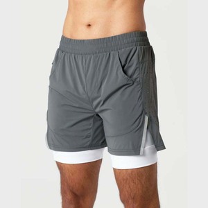 Shorts de sport gris uni pour homme, à séchage rapide, taille élastique, avec poches, taille mi-haute, en polyester tissé - Product Image 4