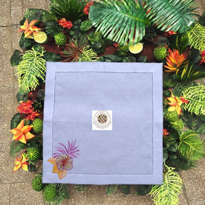 Elegant linen napkin with hibiscus and fern embroidery in one <b>corner</b>, adding tropical color and a fresh botanical touch - Product Image 4