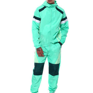 Conjunto Deportivo Retro de Invierno para Hombre, Chaqueta Cortavientos con Bloques de Color, Pantalones Deportivos, Logotipo Personalizado, Traje Deportivo Transpirable, Atuendo Elegante para Mujer - Product Image 1