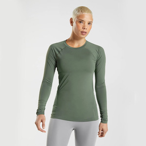 Haut de yoga tendance pour femme à manches longues et col rond, couleur unie, respirant, compressif, coupe régulière, pour entraînement sportif - Product Image 1