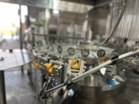 Machine de remplissage automatique de liquides Aim Technologies, 12 buses, pour bouteilles PET de 1000 ml, utilisation pour eau et boissons, contrôle PLC, cuve sous pression