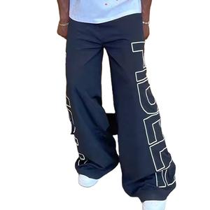 Pantalones de chándal holgados de gran tamaño deportivos para correr de alta calidad de fabricante personalizado pantalones cortavientos reflectantes para hombres de nailon - Product Image 3