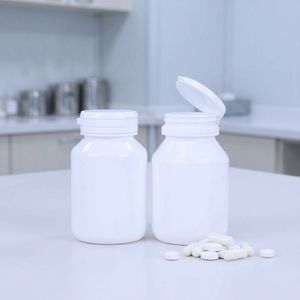 Bouteille ronde en PEHD de 100 ml blanche pour médicaments, avec bouchon à clapet facile à ouvrir, pour pilules et compléments alimentaires, fabrication OEM/ODM, usine du Vietnam - Product Image 5