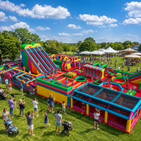 Parc d'obstacles gonflable géant commercial avec toboggan, jeux d'escalade, défis interactifs, aire de jeux d'aventure