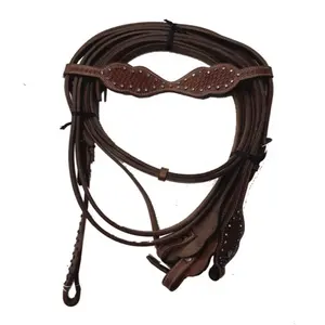 Western Head Stall with Reins Made of Good Quality DD Leather with Hand Tooling Carving with Brass Silver Metal Decoration .