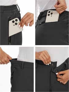 Pantalon de ski imperméable noir pour femme avec poches zippées et technologie Gore-Tex pour les activités de neige en plein air - Product Image 4