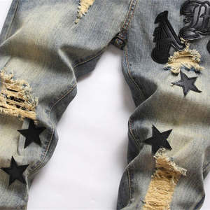 กางเกงยีนส์ผู้ชายขายดีปี 2026 แฟชั่นสตรีทลายดาว กางเกงยีนส์วินเทจสไตล์ฮิปฮอปพังก์สำหรับผู้ชาย - Product Image 5