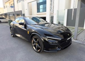 USED F_errari Purosangue is a four-door four-seater performance vehicle <b>powered</b> by a naturally aspirated 6.5-liter V12 engine - Product Image 1