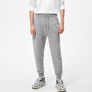 Pantalones de gimnasio ajustados personalizados para hombre, ropa deportiva de algodón transpirable, cierre de cintura elástica, estilo informal, sudor liso para entrenamiento - Product Image 1