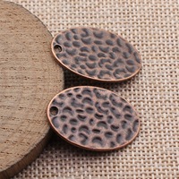 Colgante ovalado martillado con hoyuelos 30x20mm de aleación de zinc plateado envejecido para diario, cinta o marcapáginas