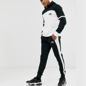 Ensemble de survêtement à capuche color block noir et blanc pour homme, personnalisable, avec pantalon de jogging, vêtements de sport athlétiques à demi-zip, fabrication sous marque privée - Product Image 1