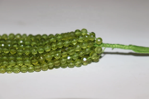 Vente en gros de perles rondes à facettes en péridot naturel de 4 à 5 mm de long pour la fabrication de bijoux boules rondes - Product Image 2