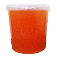 Garniture de thé à bulles à saveur de raisin avec des ingrédients Boba éclatants et du tapioca emballés dans une boîte