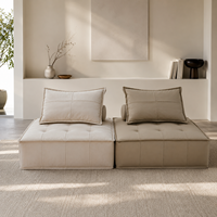 Canapé modulaire carré moderne en cuir véritable avec assise capitonnée et dossier rembourré en éponge, idéal pour appartement et hôtel
