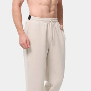 Pantalon de survêtement gris slim fit en coton pour homme, taille élastique, décontracté, respirant, en tissu tricoté, idéal pour l'automne - Product Image 1
