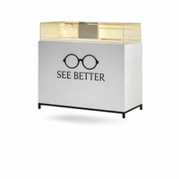 Comptoir d'exposition optique moderne avec dessus en verre, vitrine pour lunettes, table de présentation pour magasin de détail avec armoire de rangement et éclairage LED personnalisé