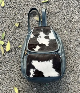 Mochila de piel de vaca con bolsillo frontal y cremallera, mochilas escolares de nuevo diseño con estilo, bolsas multiusos Unisex, productos a granel al por mayor - Product Image 2