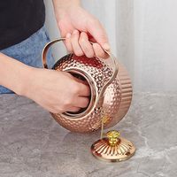 Bouteille en cuivre pur gravée et au design antique, ensemble théière en cuivre pur
