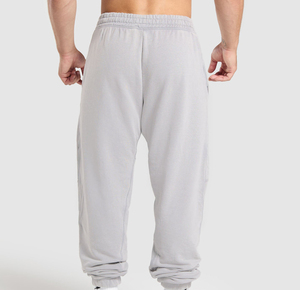 Pantalon de jogging vintage gris en coton pour homme, coupe droite, taille élastique, poches, respirant, logo imprimé sur la jambe droite, idéal pour l'automne - Product Image 4