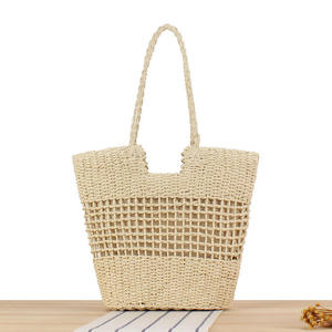Añade un toque de elegancia fresca a tu atuendo con este bolso de hilo natural hecho a mano que exhibe una encantadora textura de red. - Product Image 1