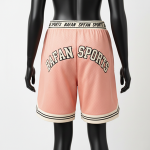 Shorts de baloncesto para mujer, premium, transpirables, de malla de poliéster, cintura elástica color melocotón, con logo bordado aplicado. - Product Image 2