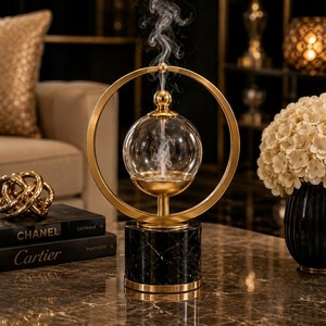 Brûle-encens design avec couvercle en marbre noir naturel et base en métal cannelé, créant une décoration luxueuse et spectaculaire. - Product Image 6