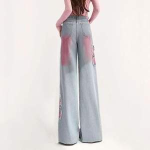 กางเกงยีนส์ขากว้างทรงบัตเตอร์ฟลายสำหรับผู้หญิง สไตล์ Y2K ปักลายกรันจ์ ทรงหลวม ขาสั้น แต่งขอบดิบ สตรีทแวร์สำหรับวัยรุ่น ระบายอากาศได้ดี - Product Image 3