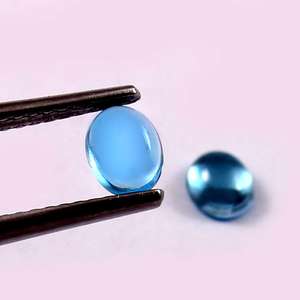 Lote al por mayor de topacio azul cielo natural de 5x7 mm, cabujón ovalado, parte trasera plana, piedra preciosa suelta calibrada para fabricación de joyas - Product Image 1