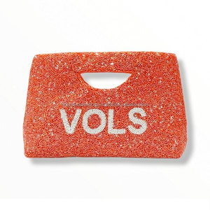 Bolso de mano con cuentas naranjas, asa integrada y letras VOLS blancas - Product Image 1