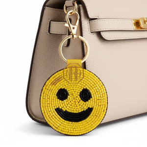 Porte-clés en perles jaunes avec visage souriant, fait main, en perles de rocaille, design amusant, article promotionnel, fournisseur - Product Image 1