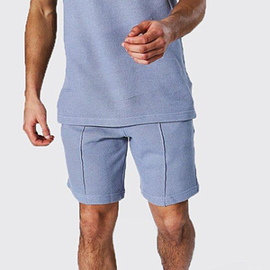 Conjunto de camiseta de algodón azul claro con cuello redondo y pantalones cortos para hombre, ropa informal de verano, transpirable, de punto, de color sólido. - Product Image 3