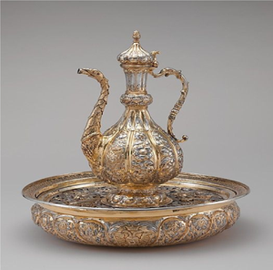 Exquisite <b>silver</b> surahi and basin set features highly dense scale-like textures and central leaf emblems. Available whole - Product Image 2