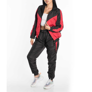 Conjunto de 2 piezas para mujer al por mayor, informal de invierno, transpirable, talla grande, cortavientos liso, chándal de longitud completa con cordón y forro de malla - Product Image 1